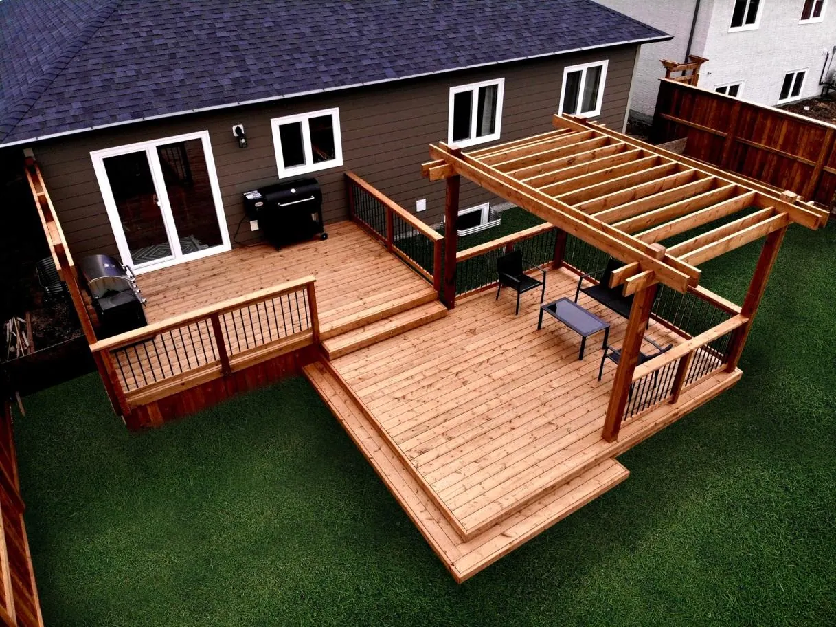 Large wood deck and outdoor living areas beside a Greenville-area style home Large wood deck and outdoor living areas beside a Greenville-area style home